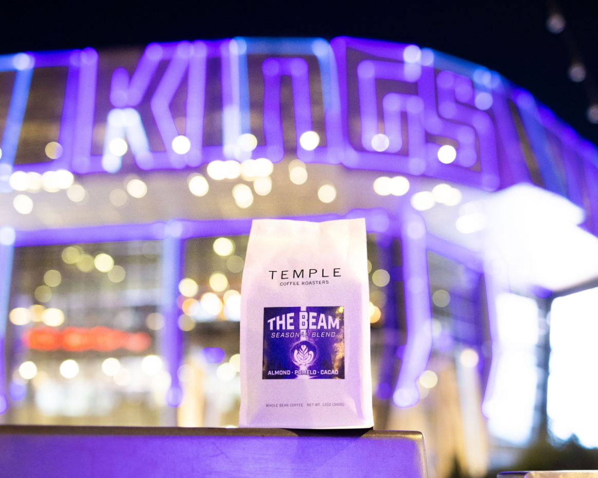 The Beam coffee bag in front of the illuminated Kings sign at Golden 1 Center