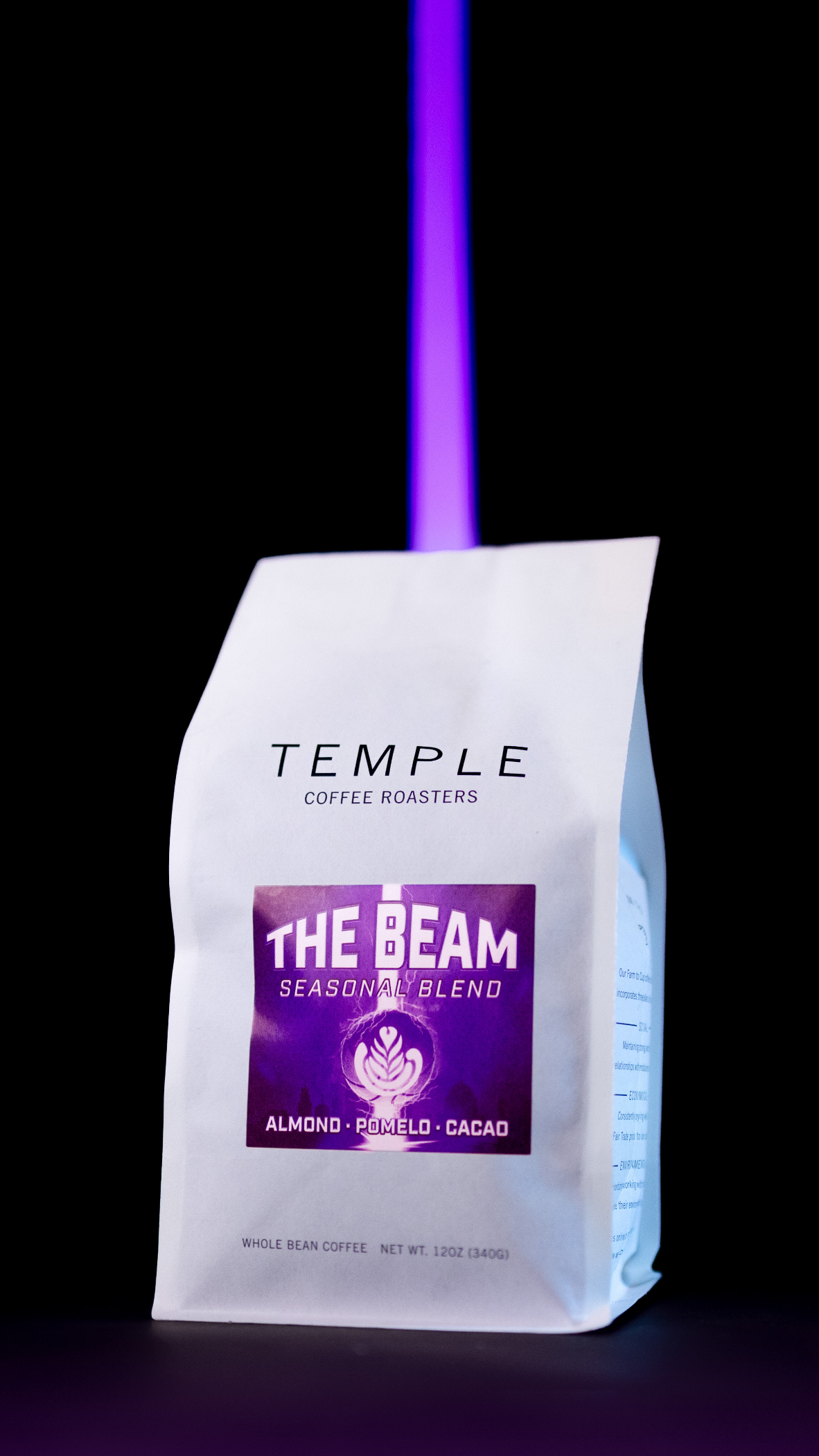 The Beam coffee bag against a black background with the beam of light