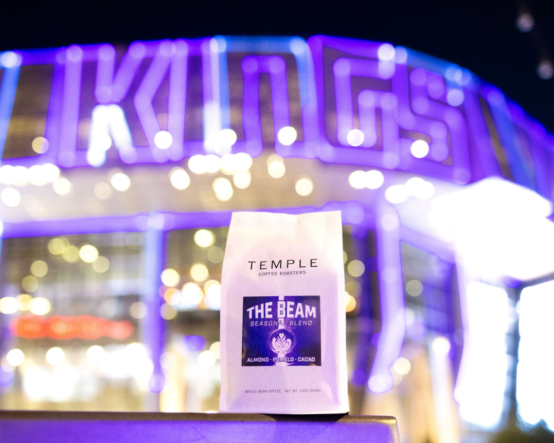 The Beam coffee bag in front of the Kings sign at Golden 1 Center